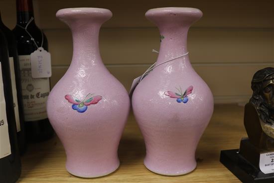 A pair of Chinese pink sgraffito ground famille rose vases